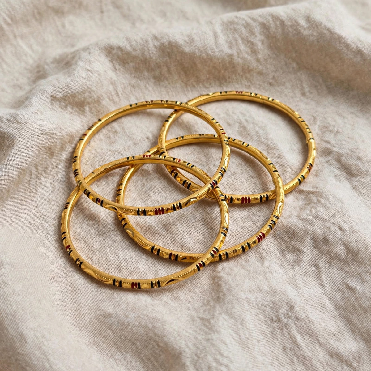 Kasturi Enamel Embossed Gold Bangle Set