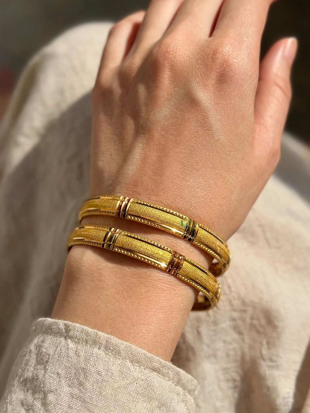 Jhilmil Green Accent Embossed Gold Bangle Set
