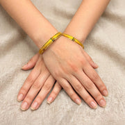 Jhilmil Green Accent Embossed Gold Bangle Set